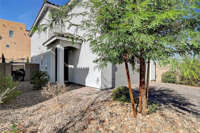 view of side of property with a garage