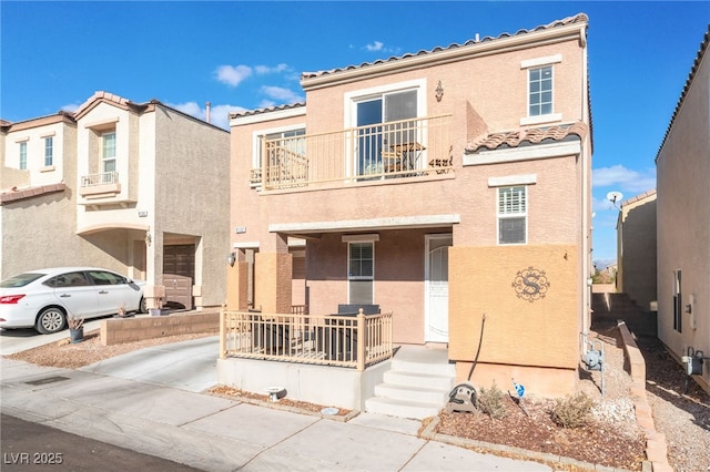 view of front of property with a balcony