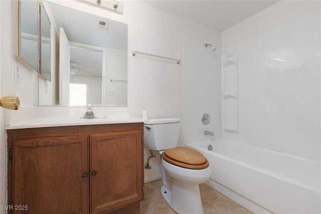 full bathroom featuring toilet, bathing tub / shower combination, ceiling fan, tile patterned flooring, and vanity