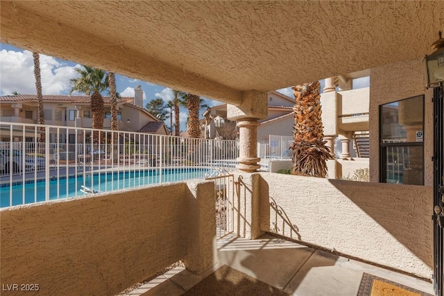 view of patio with a community pool