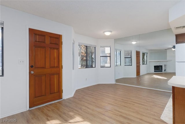 entryway featuring ceiling fan and light wood-type flooring