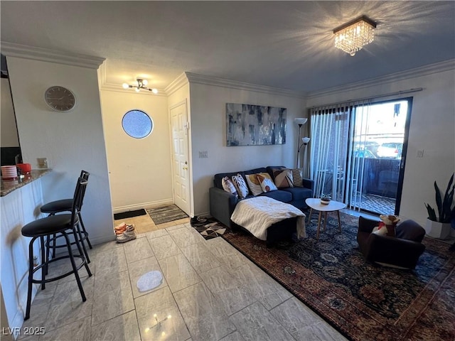 living room featuring a chandelier and ornamental molding