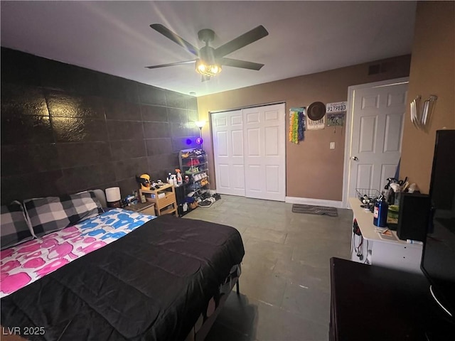 bedroom featuring ceiling fan and a closet