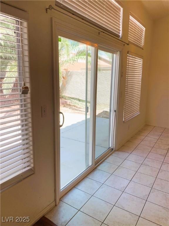 doorway featuring light tile patterned floors