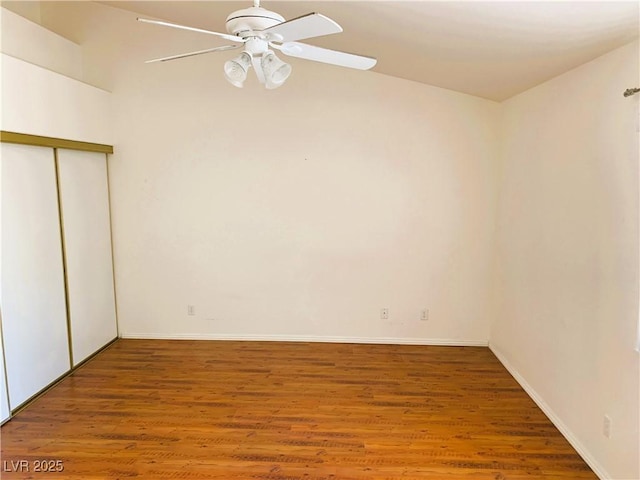 unfurnished bedroom with hardwood / wood-style floors, ceiling fan, and a closet