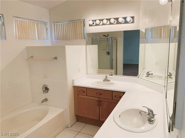 bathroom with tile patterned floors, vanity, and independent shower and bath