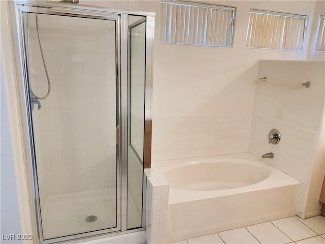 bathroom with tile patterned flooring and plus walk in shower