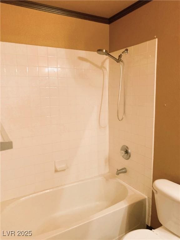 bathroom with shower / bath combination, toilet, and crown molding