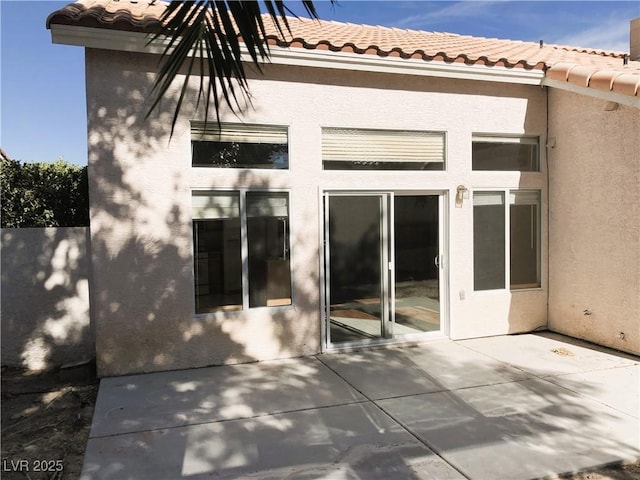 rear view of house featuring a patio area