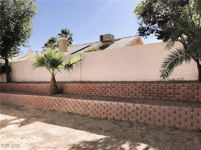 view of side of home with cooling unit