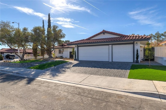 view of front facade with a front yard and a garage