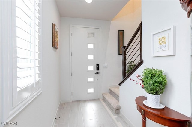 foyer entrance featuring plenty of natural light