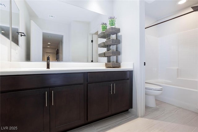 full bathroom with washtub / shower combination, vanity, and toilet