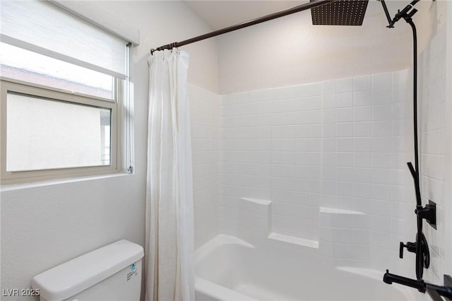 bathroom featuring shower / bath combination with curtain and toilet