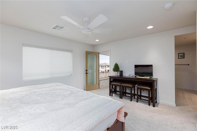 carpeted bedroom with ceiling fan