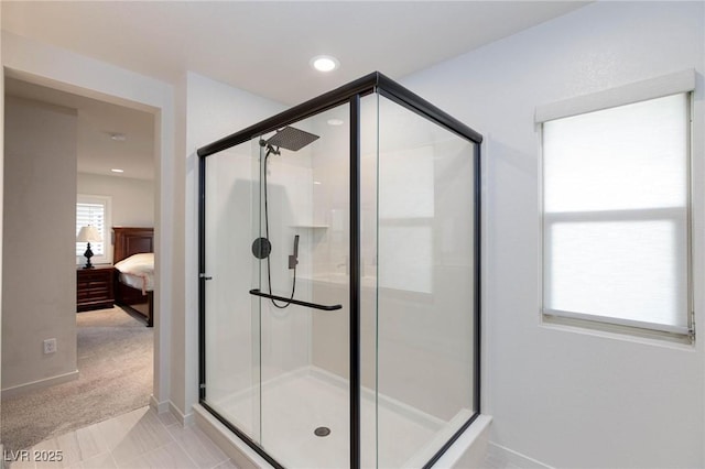 bathroom featuring tile patterned flooring and a shower with shower door