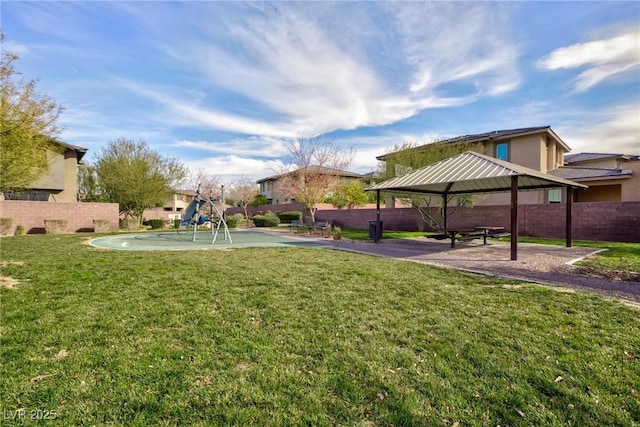 view of home's community featuring a gazebo, a playground, and a lawn