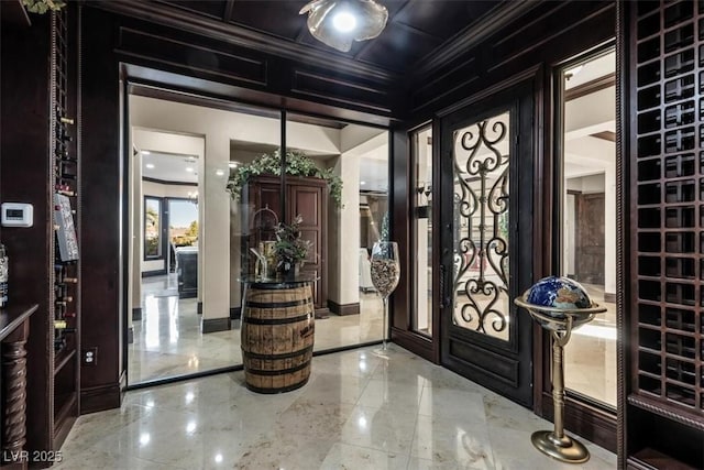 entrance foyer featuring ornamental molding