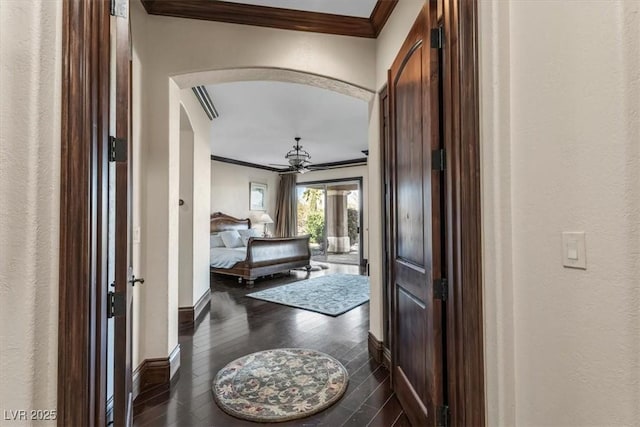 corridor featuring crown molding and dark wood-type flooring