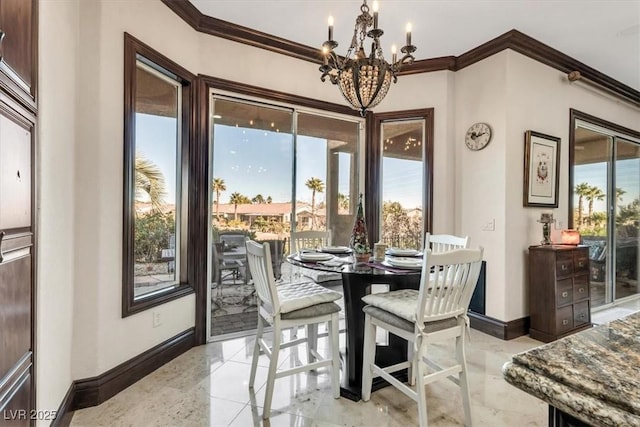 dining room with crown molding and an inviting chandelier