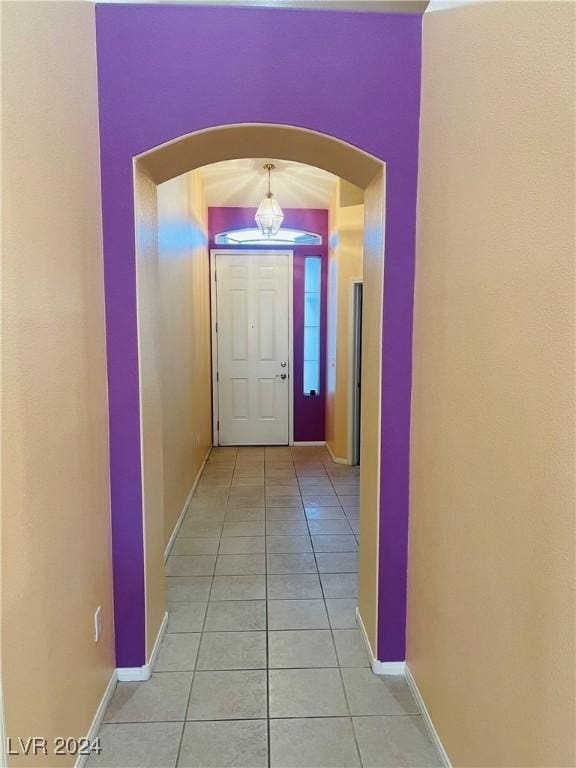 hallway featuring light tile patterned floors