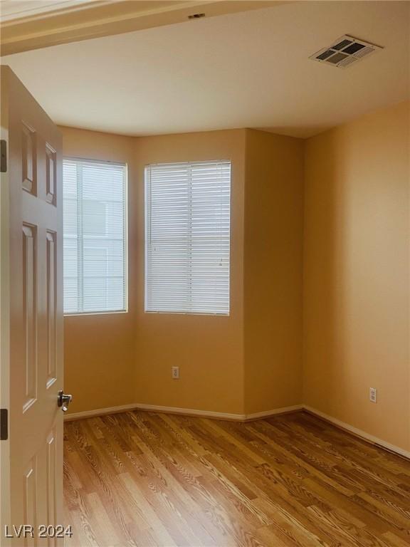 unfurnished room featuring light wood-type flooring