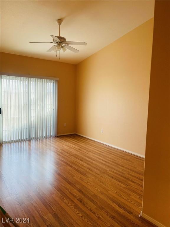 spare room featuring hardwood / wood-style flooring and ceiling fan