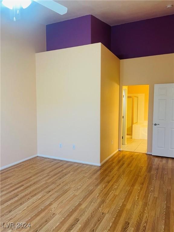 empty room featuring light hardwood / wood-style floors and ceiling fan