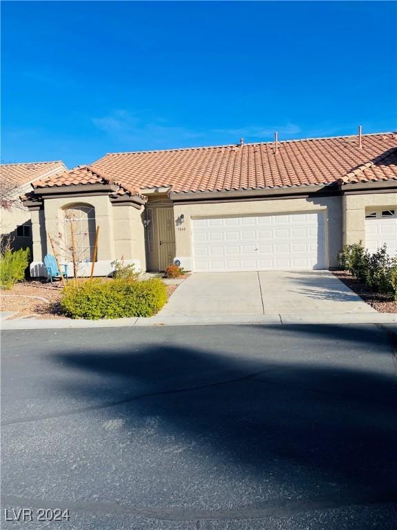 view of front of property with a garage