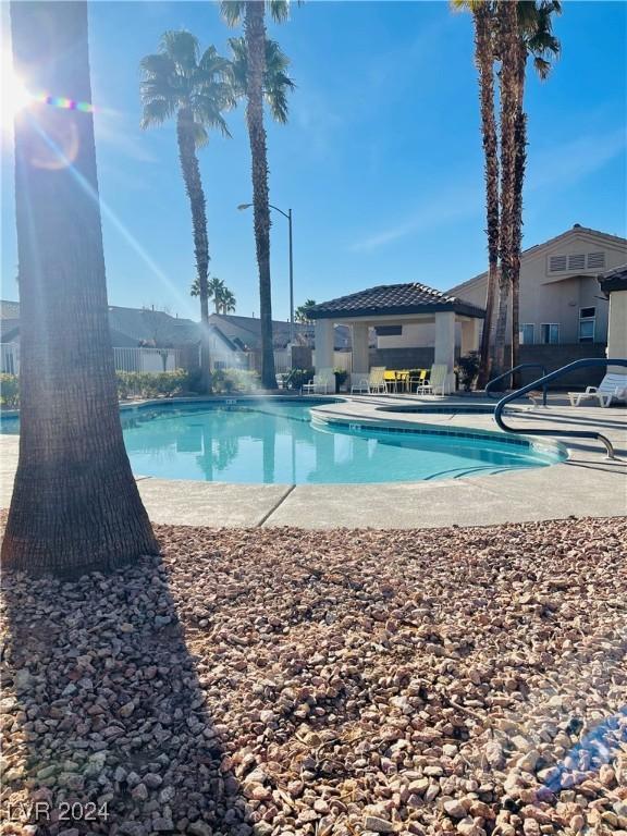 view of swimming pool with a patio