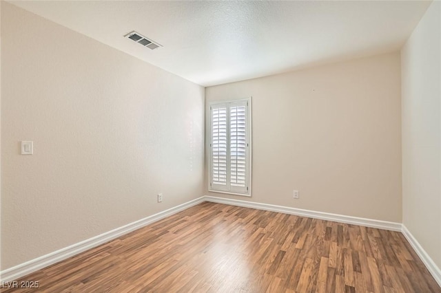 empty room featuring hardwood / wood-style floors