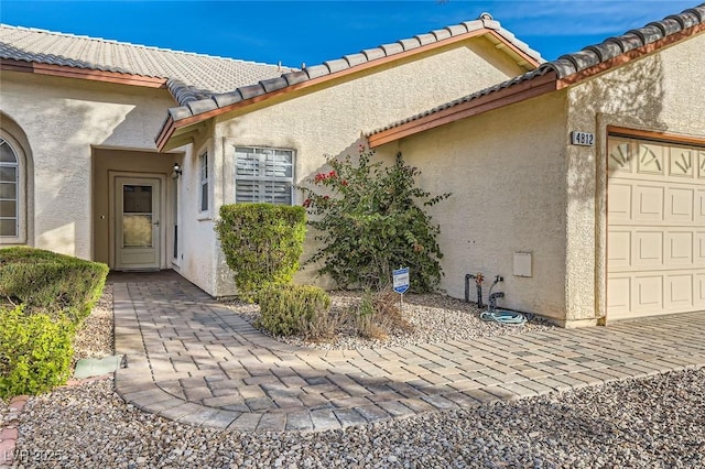 property entrance featuring a garage