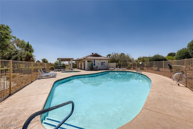 view of swimming pool featuring a patio area