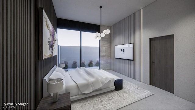 bedroom with wooden walls and a chandelier