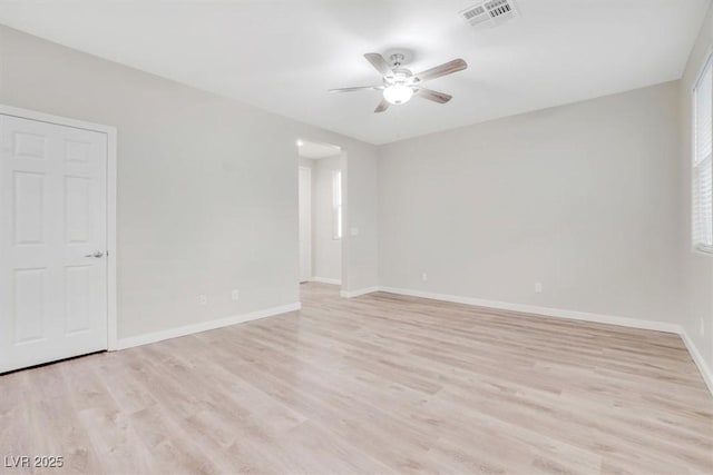 unfurnished room featuring light hardwood / wood-style floors and ceiling fan