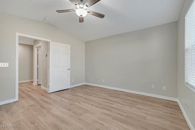 unfurnished bedroom with light wood-type flooring, ceiling fan, and lofted ceiling