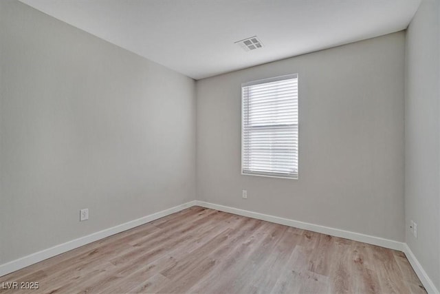 unfurnished room featuring light hardwood / wood-style floors