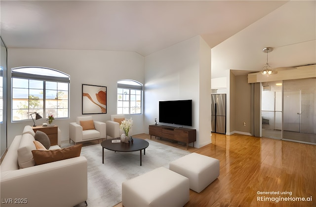 living room with lofted ceiling and hardwood / wood-style floors