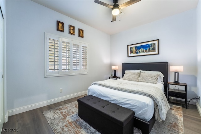 bedroom with ceiling fan and dark wood-type flooring