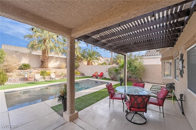 view of patio / terrace featuring a fenced in pool and a pergola