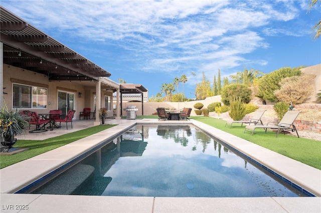 view of swimming pool featuring a lawn, a pergola, and a patio