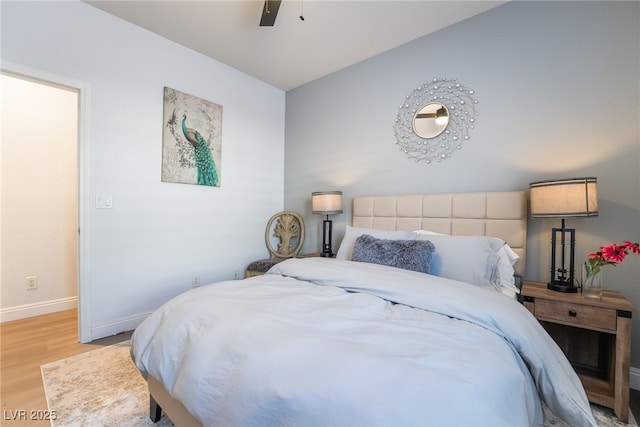 bedroom with ceiling fan and hardwood / wood-style flooring