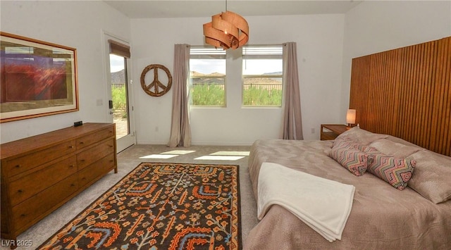 carpeted bedroom featuring access to outside