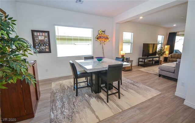 dining room featuring light wood-type flooring