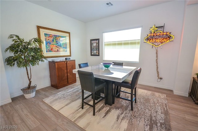 dining room with light wood-type flooring