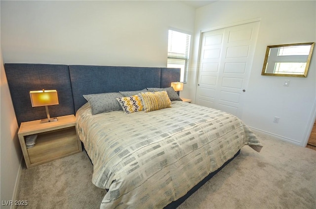 carpeted bedroom featuring a closet