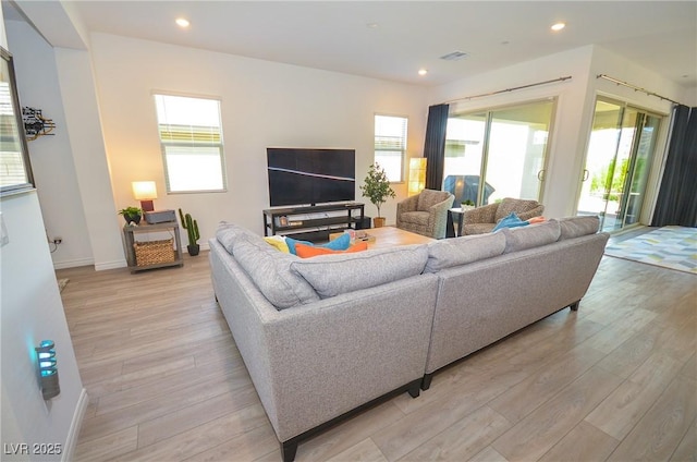 living room with light hardwood / wood-style flooring