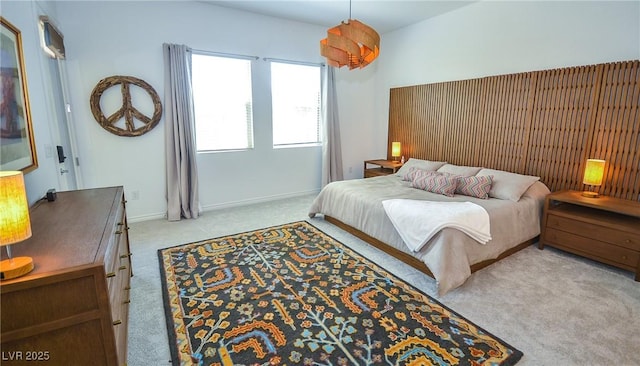 bedroom featuring light colored carpet