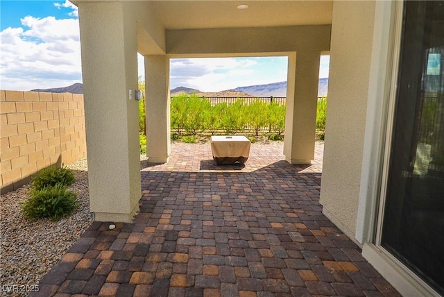 view of patio / terrace featuring a mountain view