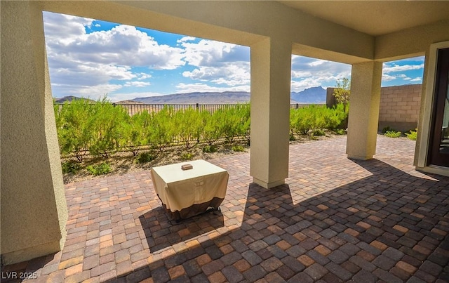 view of patio with a mountain view